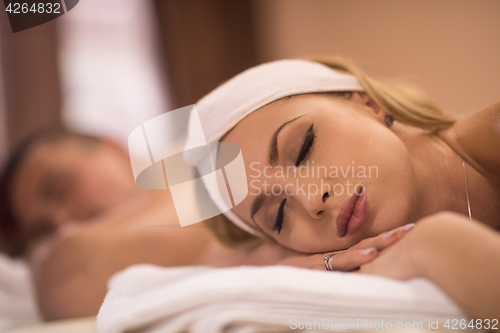 Image of young couple lying on massage table