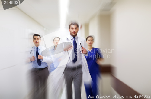 Image of group of medics walking along hospital