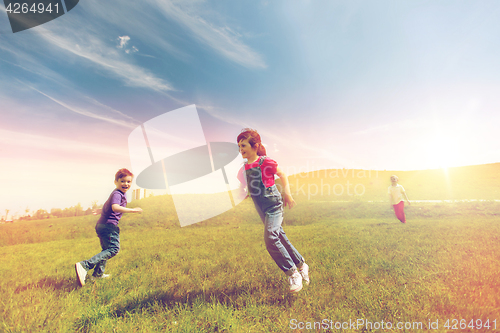 Image of group of happy kids running outdoors