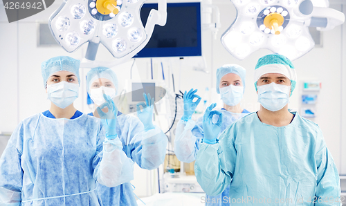 Image of group of surgeons in operating room at hospital