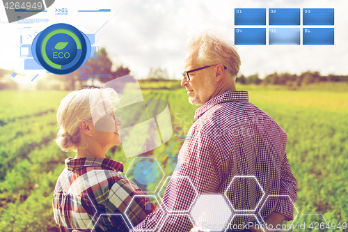 Image of happy senior couple at summer farm