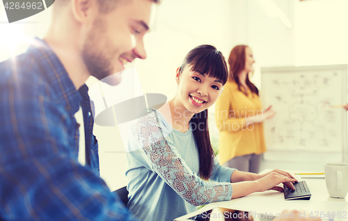 Image of creative team with tablet pc computer at office