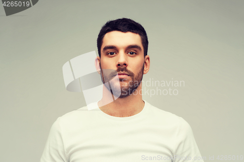 Image of young man portrait over gray background