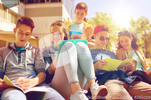 Image of group of students with notebooks at school yard