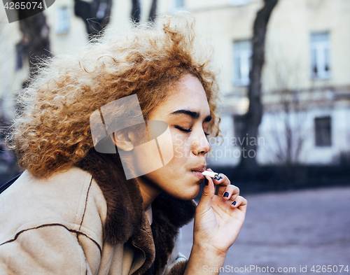 Image of young pretty girl teenage outside smoking cigarette close up, lo