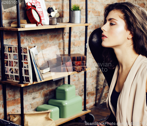 Image of young pretty woman waiting alone in modern loft studio, hipster modern girl, fashion musician concept, lifestyle people 