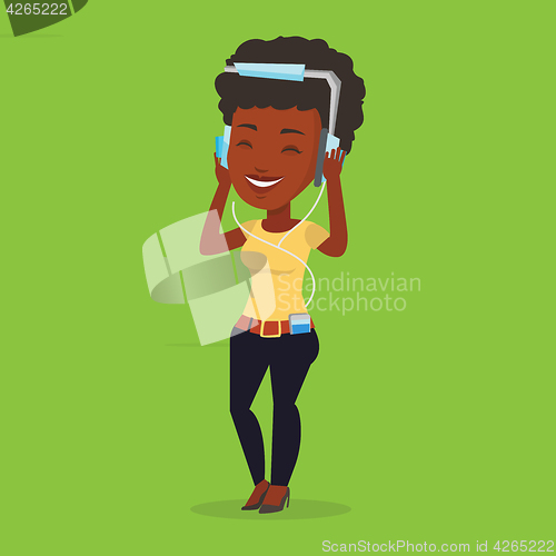 Image of Young woman in headphones listening to music.