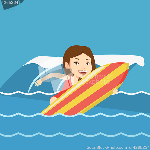 Image of Happy surfer in action on a surf board.