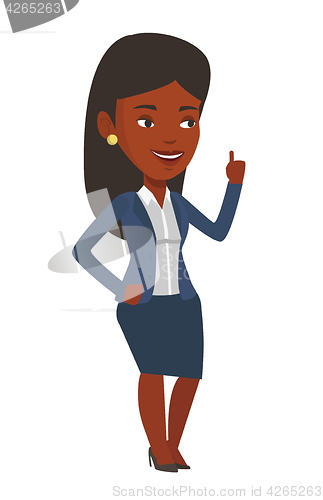 Image of Smiling businesswoman pointing with her forefinger