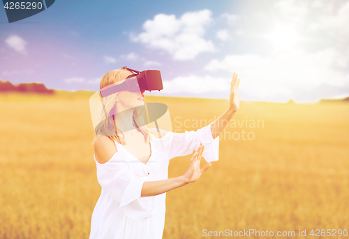 Image of woman in virtual reality headset on cereal field