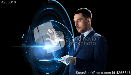Image of businessman with tablet pc and virtual projection