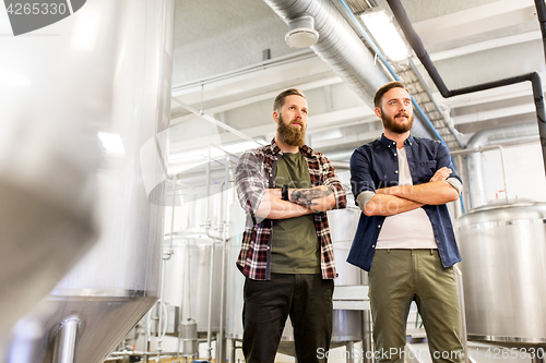 Image of men at craft brewery or beer plant