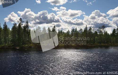 Image of Lake amongst the woods, cloudy summer sky, Sweden