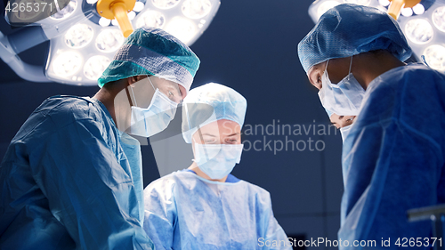 Image of group of surgeons in operating room at hospital