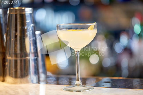 Image of glass of cocktail at bar