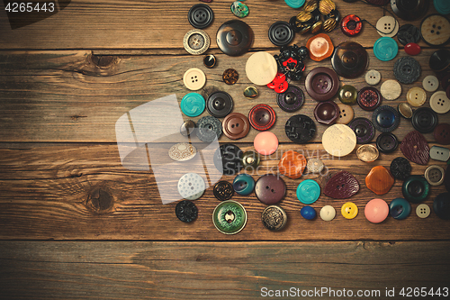 Image of vintage buttons on the wooden boards