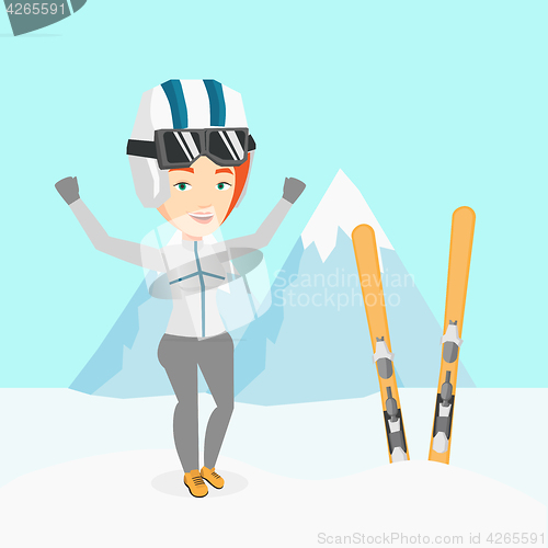 Image of Cheerful skier standing with raised hands.