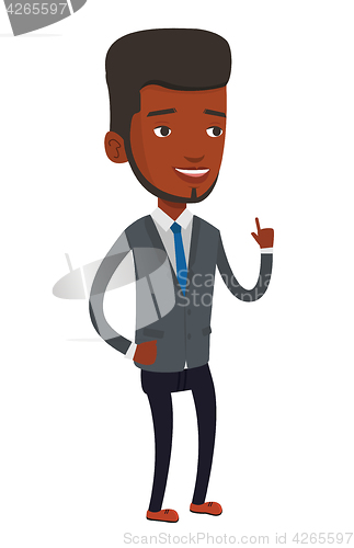 Image of Smiling businessman pointing with his forefinger.