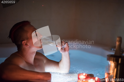 Image of man relaxing in the jacuzzi