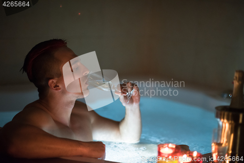 Image of man relaxing in the jacuzzi