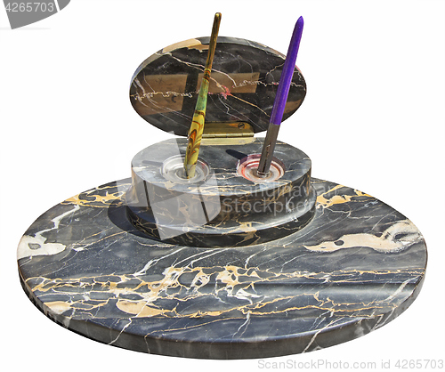 Image of Old vintage pens on a stone stand