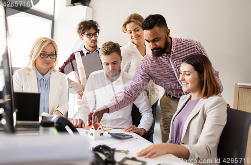 Image of business team discussing house project at office