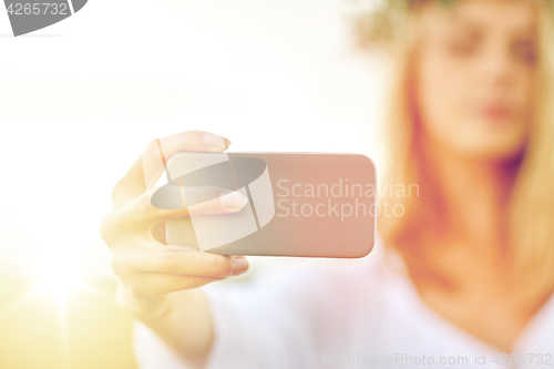 Image of close up of woman taking selfie by smartphone