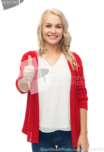 Image of happy smiling young woman showing thumbs up