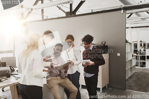 Image of business team with tablet pc and coffee at office