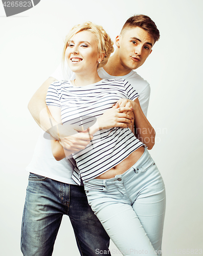 Image of young pretty teenage couple, hipster guy with his girlfriend happy smiling and hugging isolated on white background, lifestyle people concept