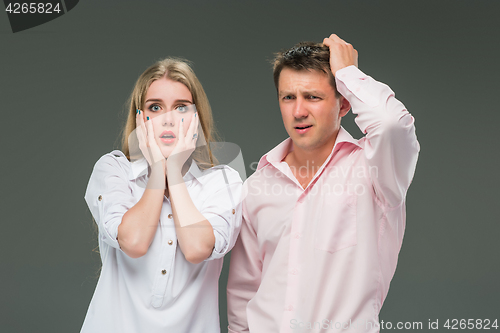 Image of The young couple with different emotions during conflict