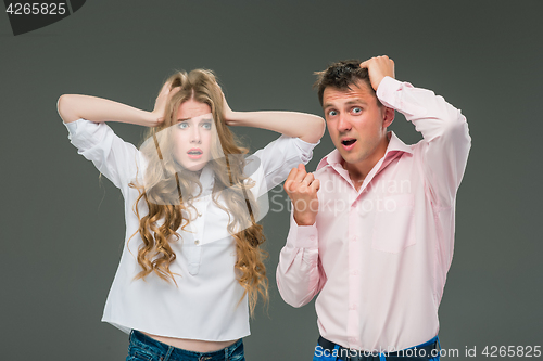 Image of The young couple with different emotions during conflict