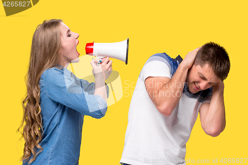 Image of Woman shouting in megaphones at each other