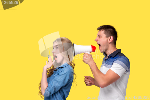 Image of Man shouting in megaphones at each other