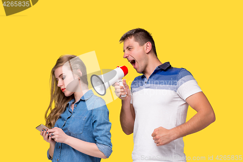 Image of Man shouting in megaphones at each other