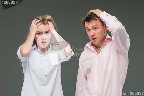 Image of The young couple with different emotions during conflict