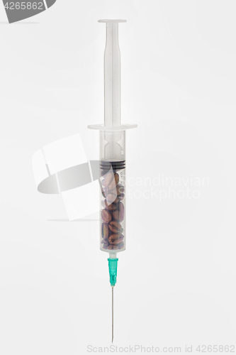 Image of Coffee beans in syringe