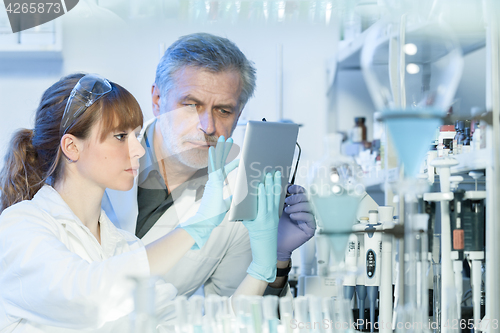 Image of Health care researchers working in scientific laboratory.