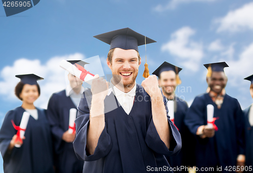 Image of happy student with diploma celebrating graduation