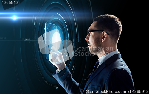 Image of businessman working with transparent tablet pc