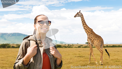 Image of happy woman with backpack traveling in africa