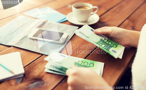 Image of close up of traveler hands counting euro money