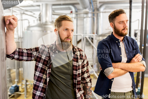 Image of men at craft brewery or beer plant