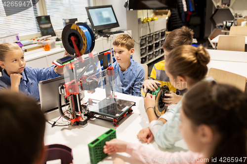 Image of happy children with 3d printer at robotics school