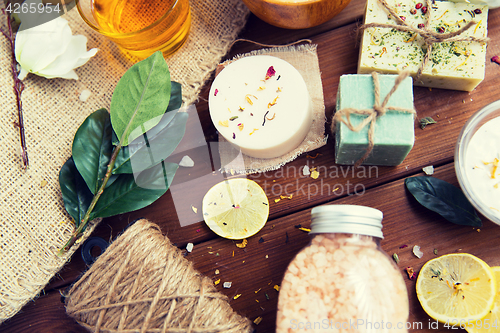 Image of close up of body care cosmetic products on wood
