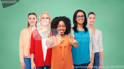 Image of international group of women showing thumbs up