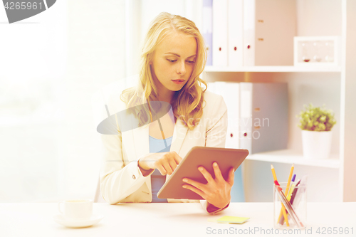 Image of businesswoman or student with tablet pc at office