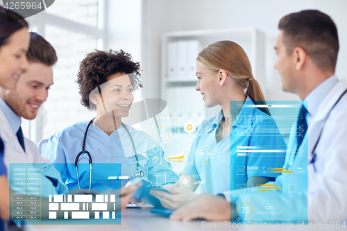 Image of group of happy doctors meeting at hospital office