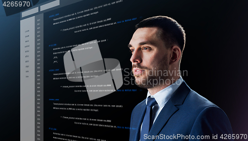 Image of businessman with coding on virtual screen