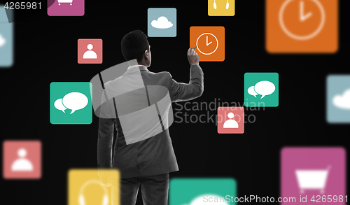 Image of businessman working with marker and virtual icons